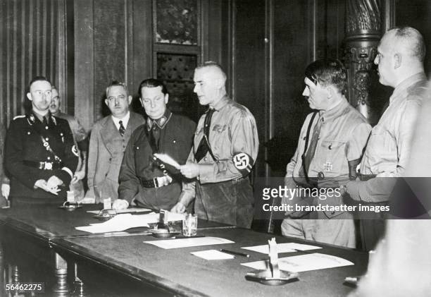 Adolf Hitler is swearing in the national socialist members of parliament . Chairman of the party Wilhelm Frick opens the meeting. Adolf Hitler and...