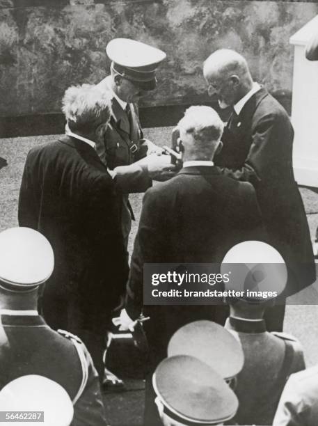 The president of the Bruckner-association Prof. Max Auer presented Adolf Hitler during an act of state on the occasion of the revelation of an Anton...