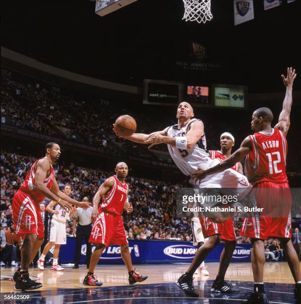 Jason Kidd of the New Jersey Nets makes a layup against Rafer Alston of the Houston Rockets at Continental Airlines Arena on November 12, 2005 in...