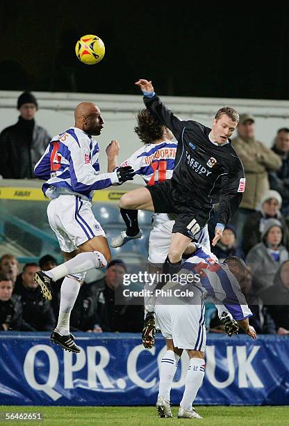 Gary McSheffery of Coventry goes up for the ball against Gareth Ainsworth and Ivan Evatt of Queens Park Rangers during the Coca Cola Championship...