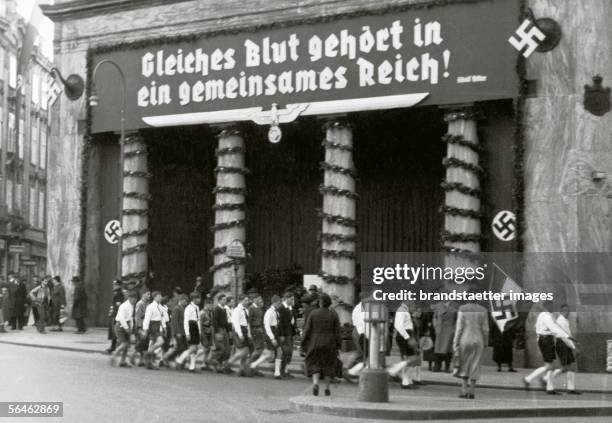 Anschluss 1938. Propaganda poster at the Loos-building in Vienna. Michaeler place. Vienna. Photography. March 1938. [Anschluss oesterreichs:...