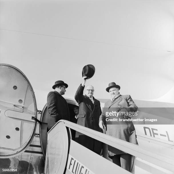 Julius Raab, Austrian Federal Chancellor, before take-off to Rome. Vienna, airport. Photography. 1958. [Julius Raab, oesterr. Bundeskanzler, gruesst...