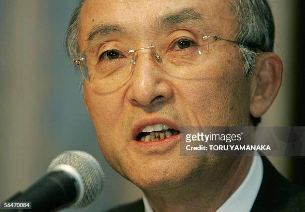 Katsuaki Watanabe, President of Japan's auto giant Toyota Motor Corporation enters a press conference room in Nagoya, central Japan, 20 December...