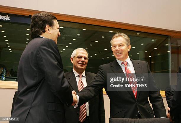 British Prime Minister Tony Blair and EU Commission President Jose Barroso shake hands as the president of the European Parliament Josep Borrell...