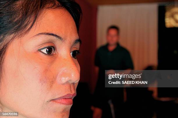 Patchara Meissmer, wife of Sascha Meissmer from Frankfurt, Germany looks on at her restaurant in Phuket province in southern Thailand, 20 December...