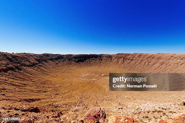 meteor crater against clear blue sky - cratera do meteoro arizona imagens e fotografias de stock