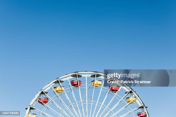 low angle view of ferris wheel against clear blue sky - santa monica bildbanksfoton och bilder
