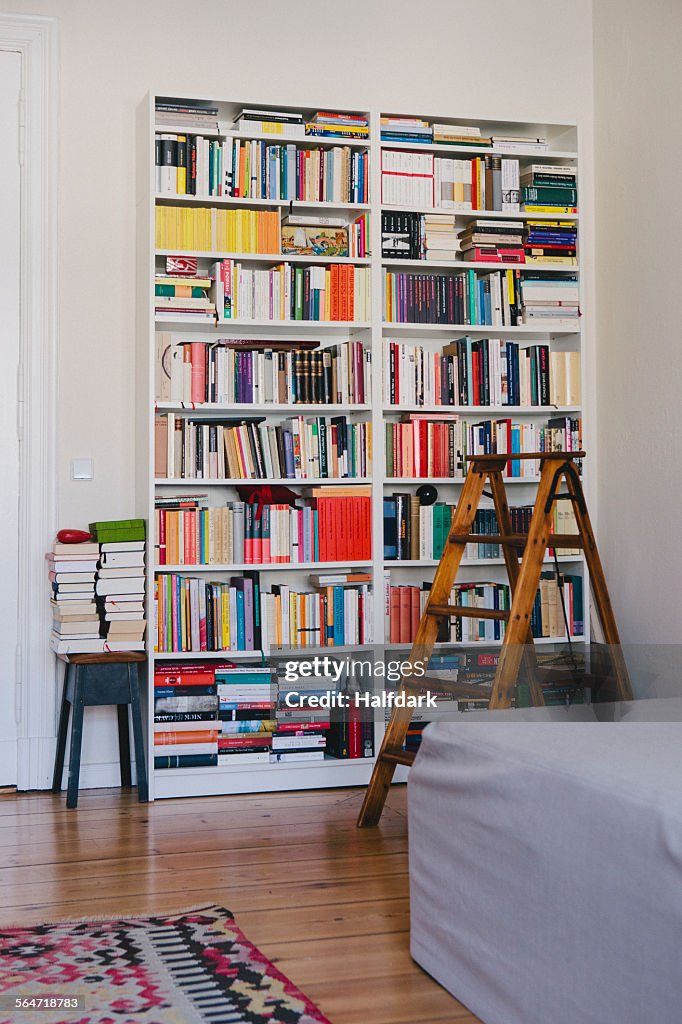 Step ladder near bookshelves at home