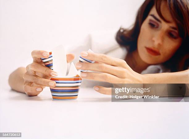 young woman with broken cup - broken cup stock-fotos und bilder