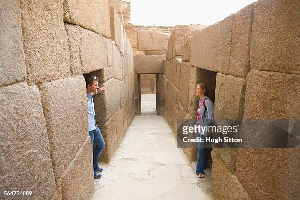 couple sightseeing in ruins - hugh sitton stock pictures, royalty-free photos & images