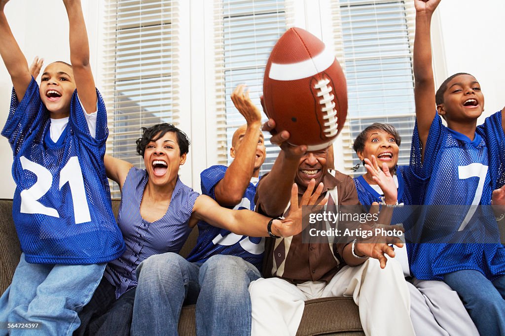 Family Watching a Football Game