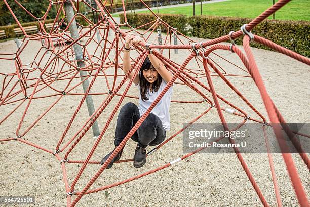 Mid Adult Woman Using Climbing Ropes Smiling At Camera High-Res