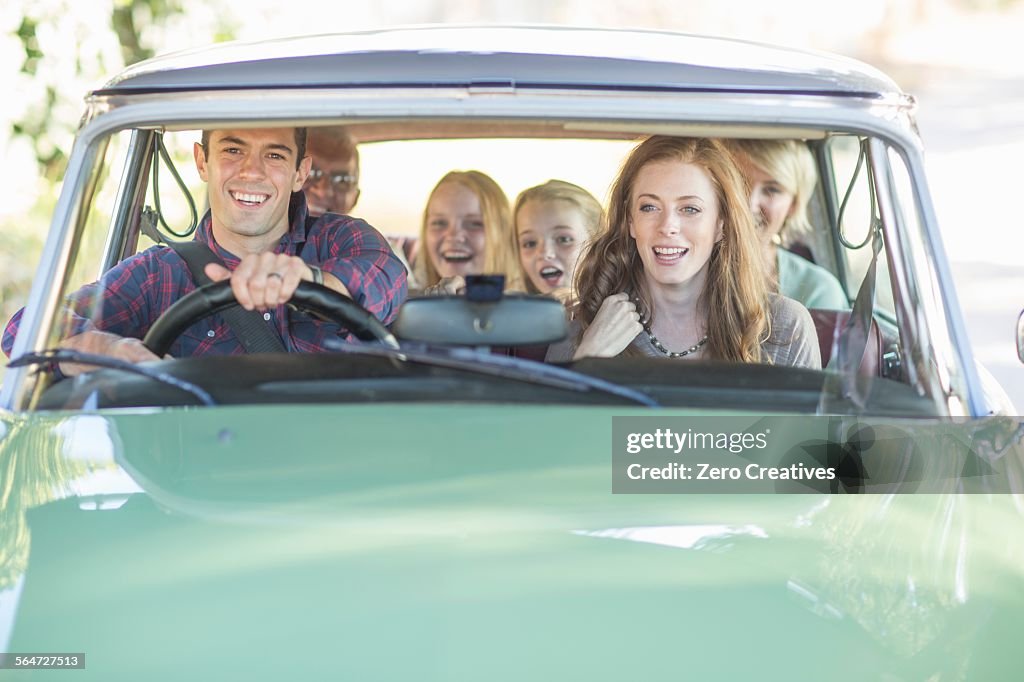 Family in car together, taking road trip