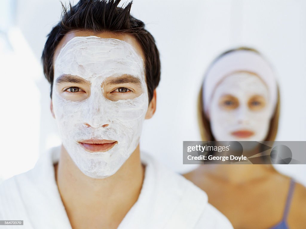 Portrait of a young couple wearing facial masks