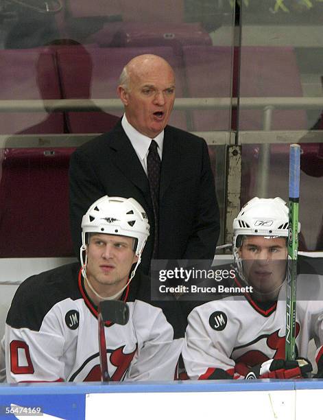 Lou Lamoriello debuts as coach of of the New Jersey Devils as they play against the New York Rangers on December 20, 2005 at Madison Square Garden in...