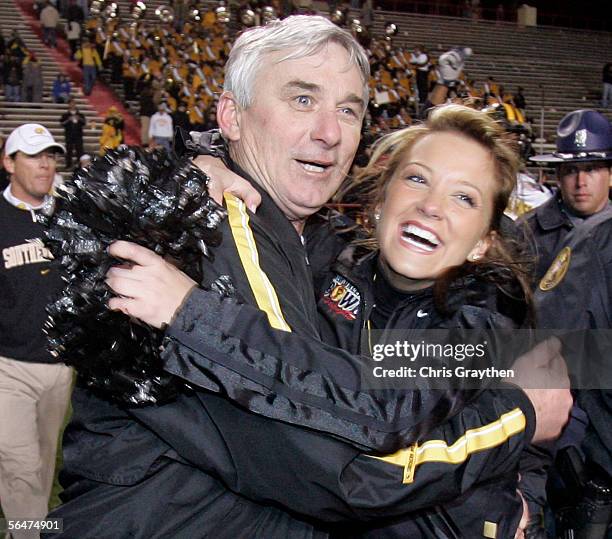 Head Coach Jeff Bower of Southern Miss hugs his daughter Stephanie after defeating Arkansas State 31-19 in The New Orleans Bowl on December 20, 2005...