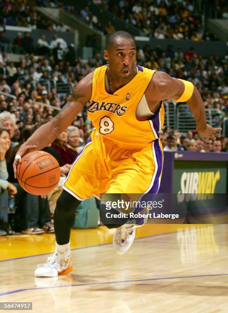 Kobe Bryant of the Los Angeles Lakers dribbles the ball in the third quarter of the game against the Dallas Mavericks on December 20, 2005 at the...