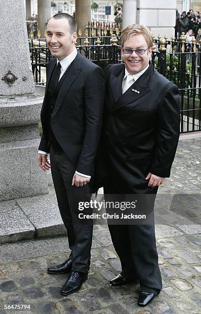 Celebrity couple Sir Elton John and David Furnish arrive for their civil partnership ceremony at the Guildhall, Windsor on December 21, 2005 in...