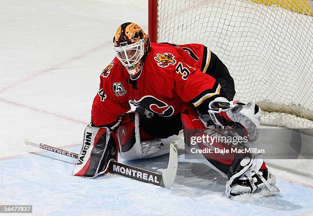 Goaltender Miikka Kiprusoff of the Calgary Flames defends his net against the Boston Bruins during their NHL game at Pengrowth Saddledome on December...