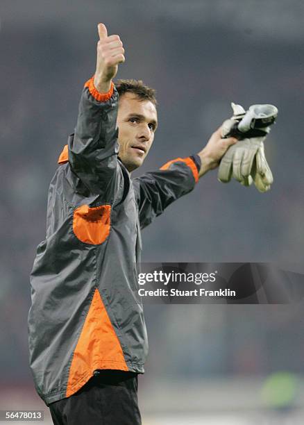 Andreas Reinke of Bremen celebrates their win at the end of the last sixteen round match in the DFB German Cup match between Hanover 96 and Werder...