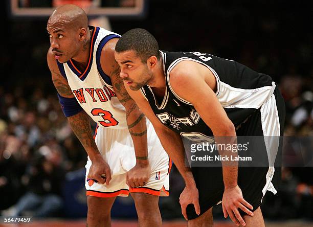 Stephon Marbury of the New York Knicks and Tony Parker of the San Antonio Spurs wait for play to resume on December 21, 2005 at Madison Square Garden...