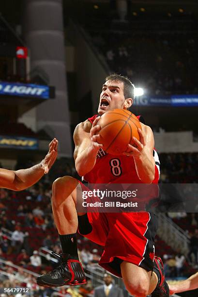 Jose Calderon of the Toronto Raptors shoots against the Houston Rockets on December 21, 2005 at the Toyota Center in Houston, Texas. NOTE TO...