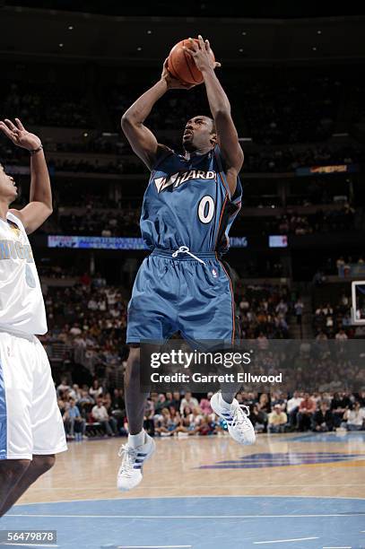 Gilbert Arenas of the Washington Wizards goes to the basket against the Denver Nuggets on December 21, 2005 at the Pepsi Center in Denver, Colorado....