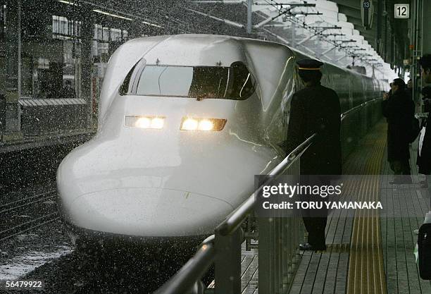 Shinkansen bullet train runs under heavy snow fall at Kyoto Station, western Japan, 22 December 2005. Record snowfall whitened wide areas of Japan,...