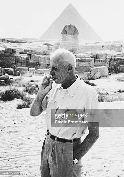 American director Howard Hawks on the set of his film 'Land of the Pharaohs', on location at the Giza Plateau in Egypt, 1955. Behind him is the Great...