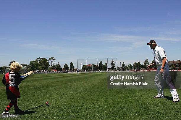 James Hird of Essendon and his son Thomas play cricket during the Six-a-Side match between Australia and the Essendon AFL Team at Windy Hill on...