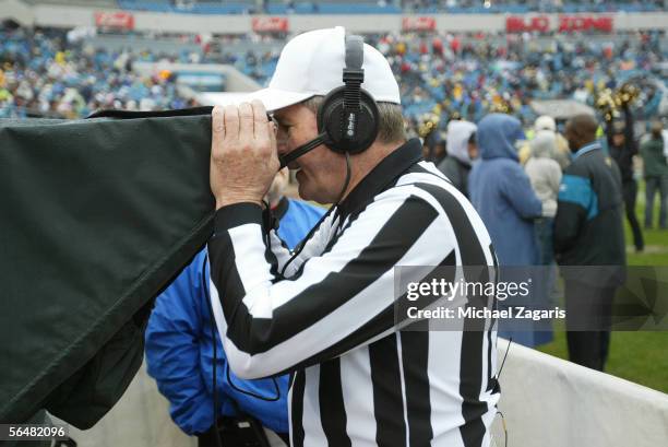 Referee Larry Nemmers reviews an instant replay during the game between the San Francisco 49ers and the Jacksonville Jaguars on December 18, 2005 at...