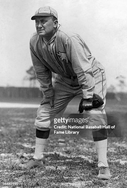 Ty Cobb of the Philadelphia Athletics stands at center field during a game. Ty Cobb played for the Philadelphia Athletics from 1927-1928.