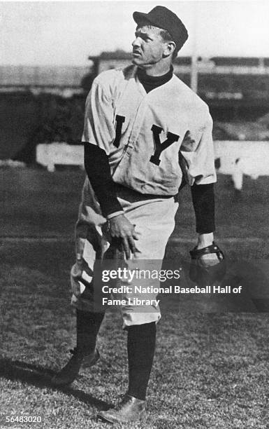 Pitcher Christy Mathewson of the New York Giants warms up his arm before a game. Christy Mathewson played for the New York Giants from 1900-1916.