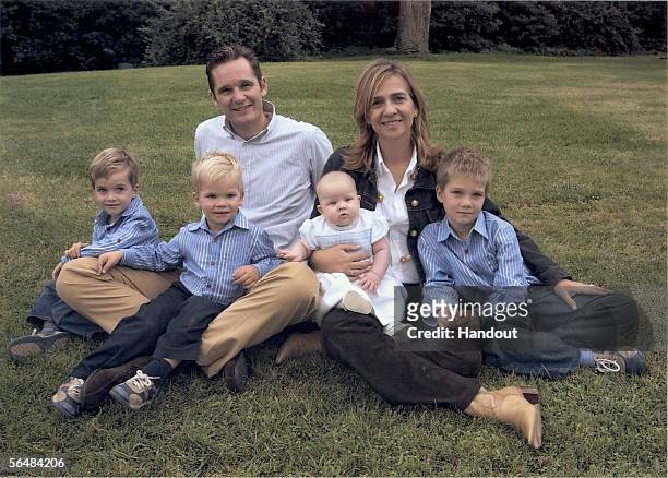 In this handout image from the Spanish Royal House, Spanish Princess Cristina and her husband Inaki Urdangarin pose with their children Pablo,...