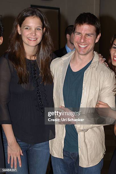 Actors Tom Cruise and Katie Holmes appear backstage at the at the Y100.7 Jingle Ball on December 17, 2005 in Sunrise, Florida.