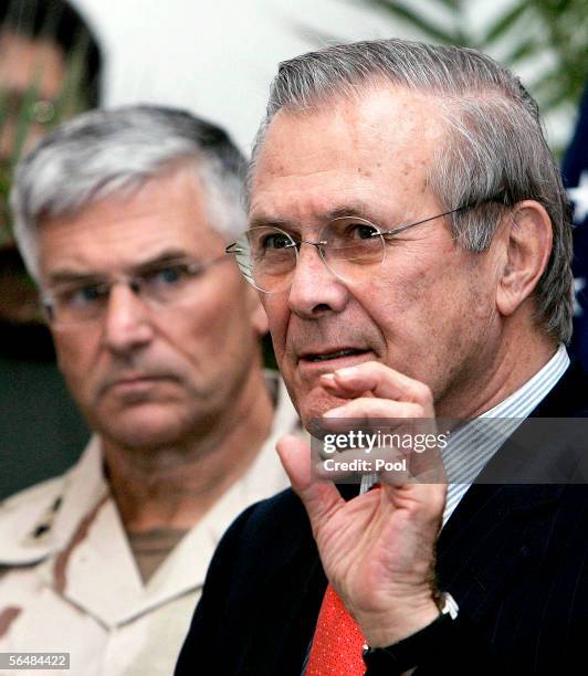 Secretary of Defense Donald Rumsfeld speaks at a news conference as Gen. George Casey, Commanding General Multi-National Force Iraq, listens on...