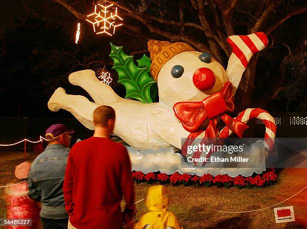 Visitors look at Mr. Bingle, a New Orleans Christmas icon that survived Hurricane Katrina, at City Park's Celebration in the Oaks in the Lakeview...