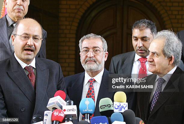 Iraqi Planning Minister Barham Saleh speaks to the press as Iyad al-Samarrai of the National Concord Front and Mahdi al-Hafez of the Iraqi National...