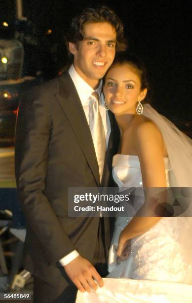 In this handout photo, Brazilian soccer star Kaka , who plays for Italian club AC Milan, poses with his bride Caroline Celico during their wedding in...