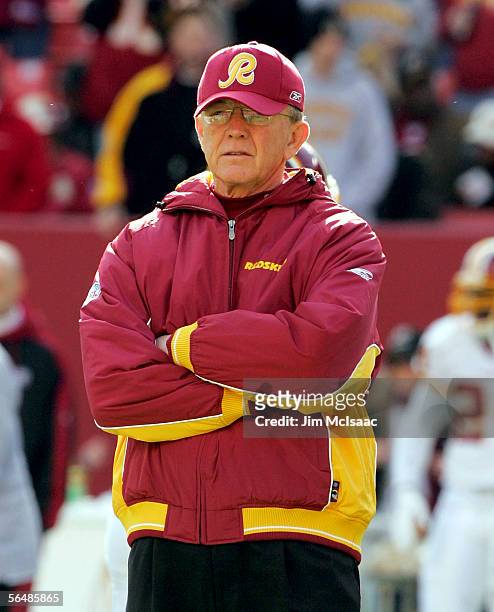 Head coach Joe Gibbs of the Washington Redskins stands on the field before the game against the New York Giants on December 24, 2005 at Fed Ex Field...