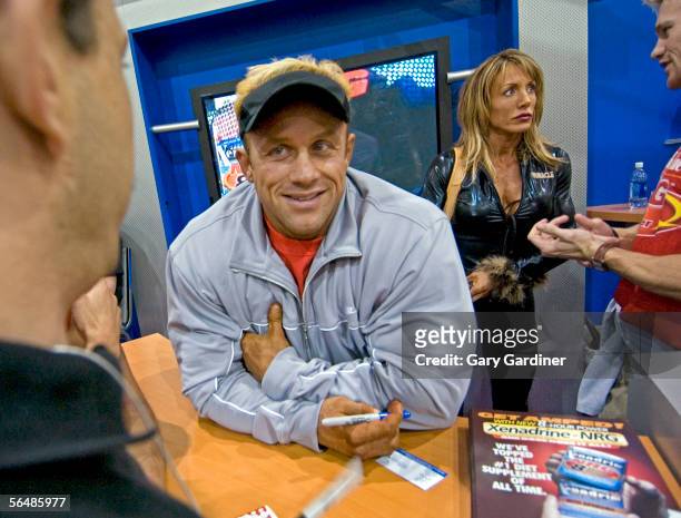 Bodybuilder Craig Titus talks with a fan at the Arnold Fitness EXPO during the 2004 Arnold Classic bodybuilding competition on March 7, 2004 in...