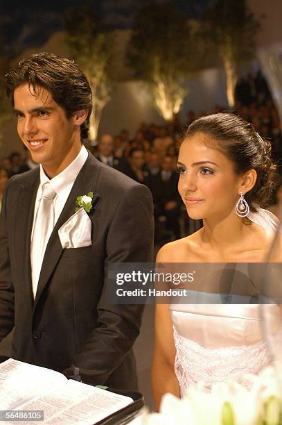 In this handout photo, Brazilian soccer star Kaka , who plays for Italian club AC Milan, poses with his bride Caroline Celico during their wedding in...