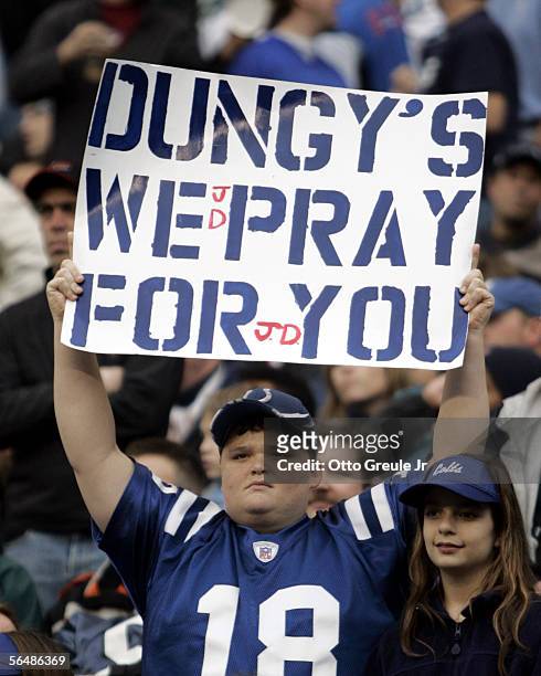 Fan holds a message of support to the family of head coach Tony Dungy of the Indianapolis Colts during the first half of the game against the Seattle...