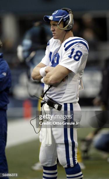 Quarterback Peyton Manning of the Indianapolis Colts watches the second half of the game against the Seattle Seahawks from the sidelines at Qwest...