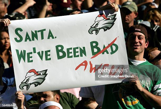 Philadelphia Eagles fan holds a sign lamenting the state of the team during the game with the Arizona Cardinals on December 24, 2005 at Sun Devil...