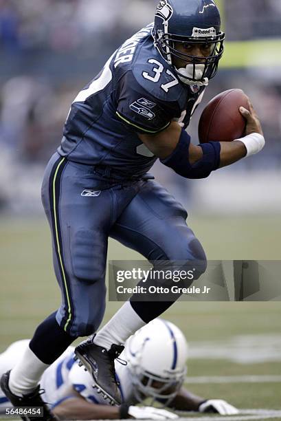 Running back Shaun Alexander of the Seattle Seahawks rushes against the Indianapolis Colts in the first half at Qwest Field on December 24, 2005 in...