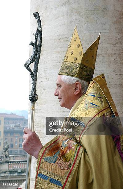 Pope Benedict XVI gives his "Urbi et Orbi" blessing from the Central Loggia of the Vatican Basilica during solemnity of the birth of Our Lord on...