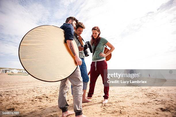 making of a videoclip on the beach - film crew outside stock pictures, royalty-free photos & images
