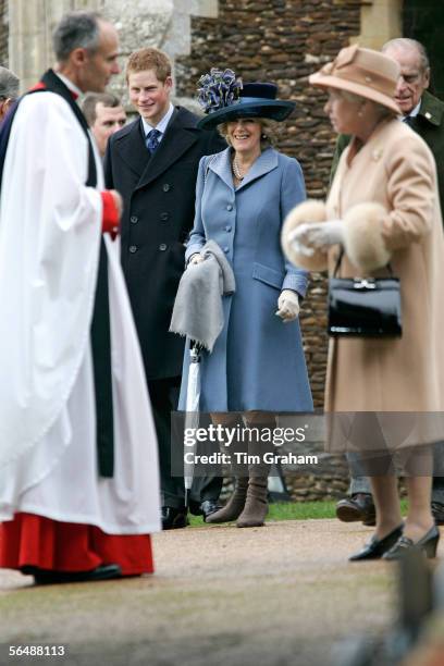 Queen Elizabeth II, Prince Harry and Camilla, Duchess of Cornwall, attend Christmas Day service at Sandringham Church on December 25, 2005 in King's...