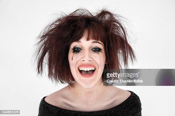 young woman with smudged make-up, laughing - cabello desmelenado fotografías e imágenes de stock
